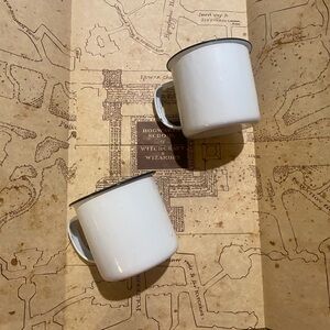Two (2) White Enamel Mugs ASO Harry Potter and the Deathly Hallows Part 1 & 2